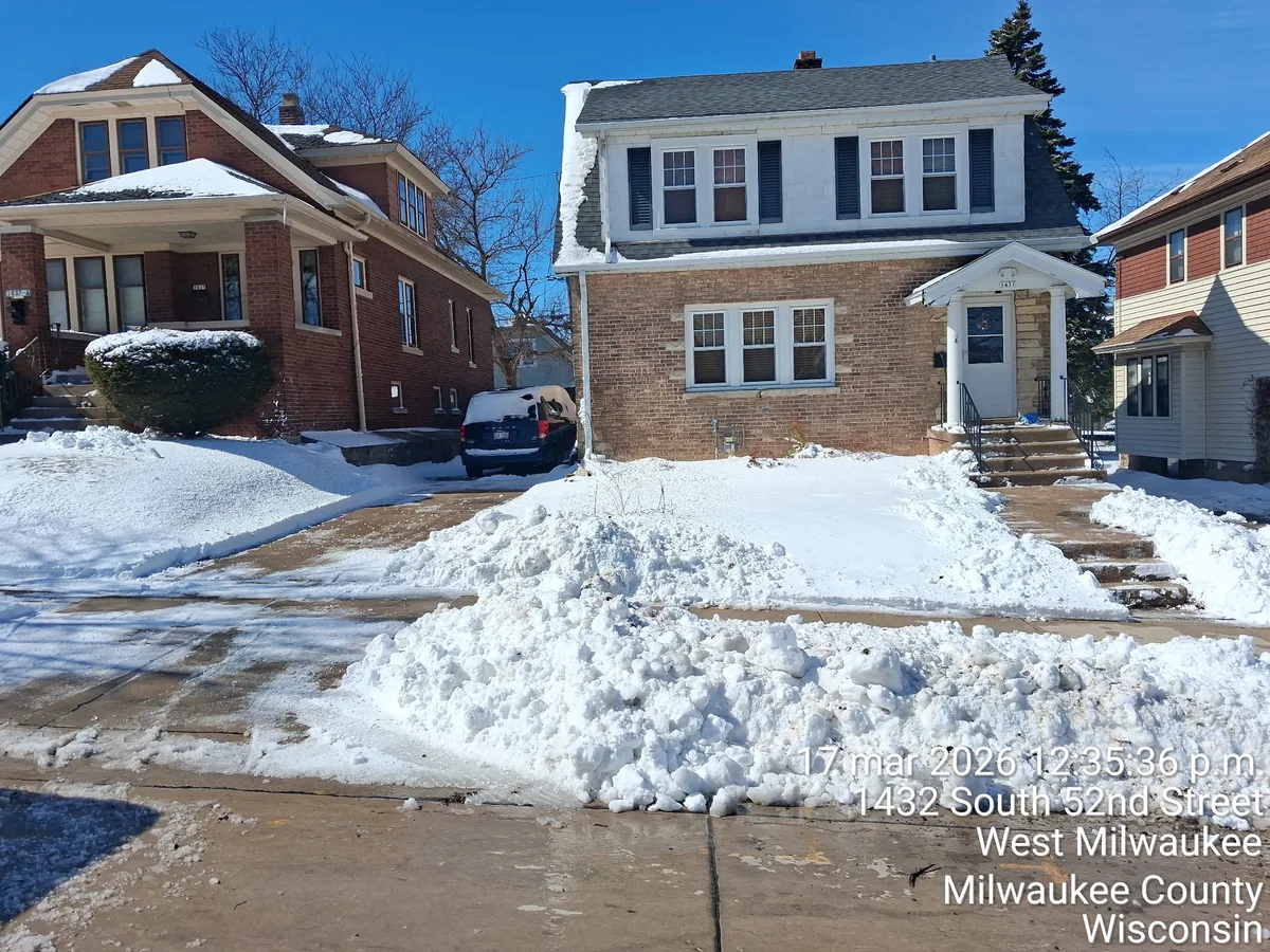 Cleared driveway with snow banked to the side